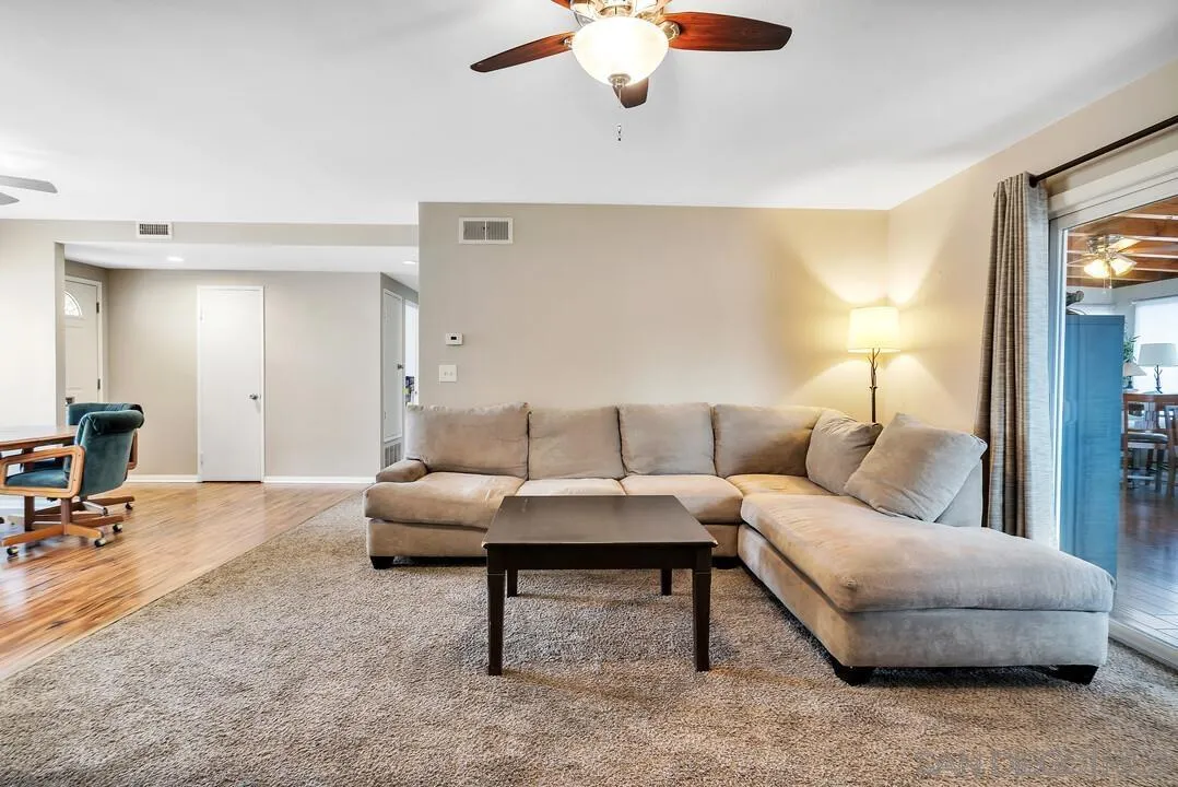 9677 Lutheran Way Santee, CA 92071 - Photo 12 of 33 a living room with furniture and a lamp