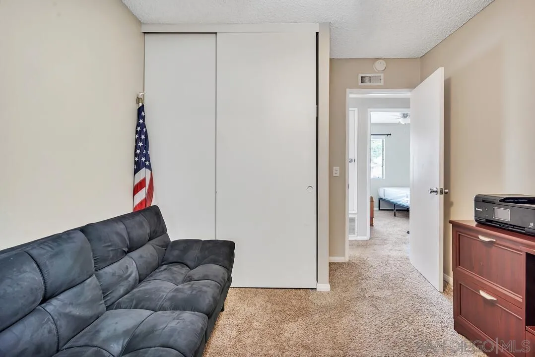 9677 Lutheran Way Santee, CA 92071 - Photo 15 of 33 a living room with furniture and a flat screen tv
