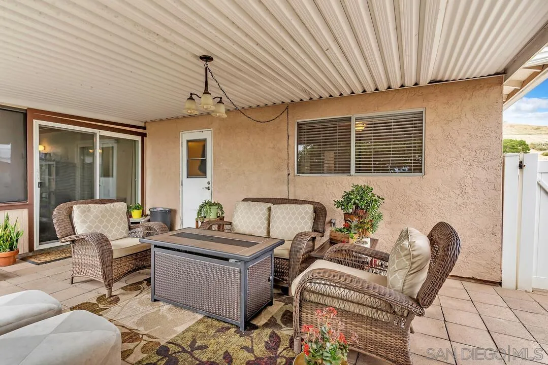 9677 Lutheran Way Santee, CA 92071 - Photo 27 of 33 a living room with furniture and a window