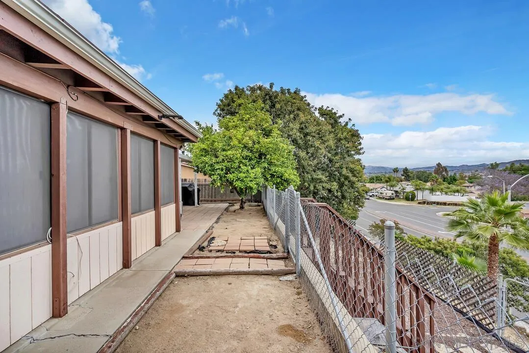 9677 Lutheran Way Santee, CA 92071 - Photo 29 of 33 a view of a balcony with wooden floor and fence