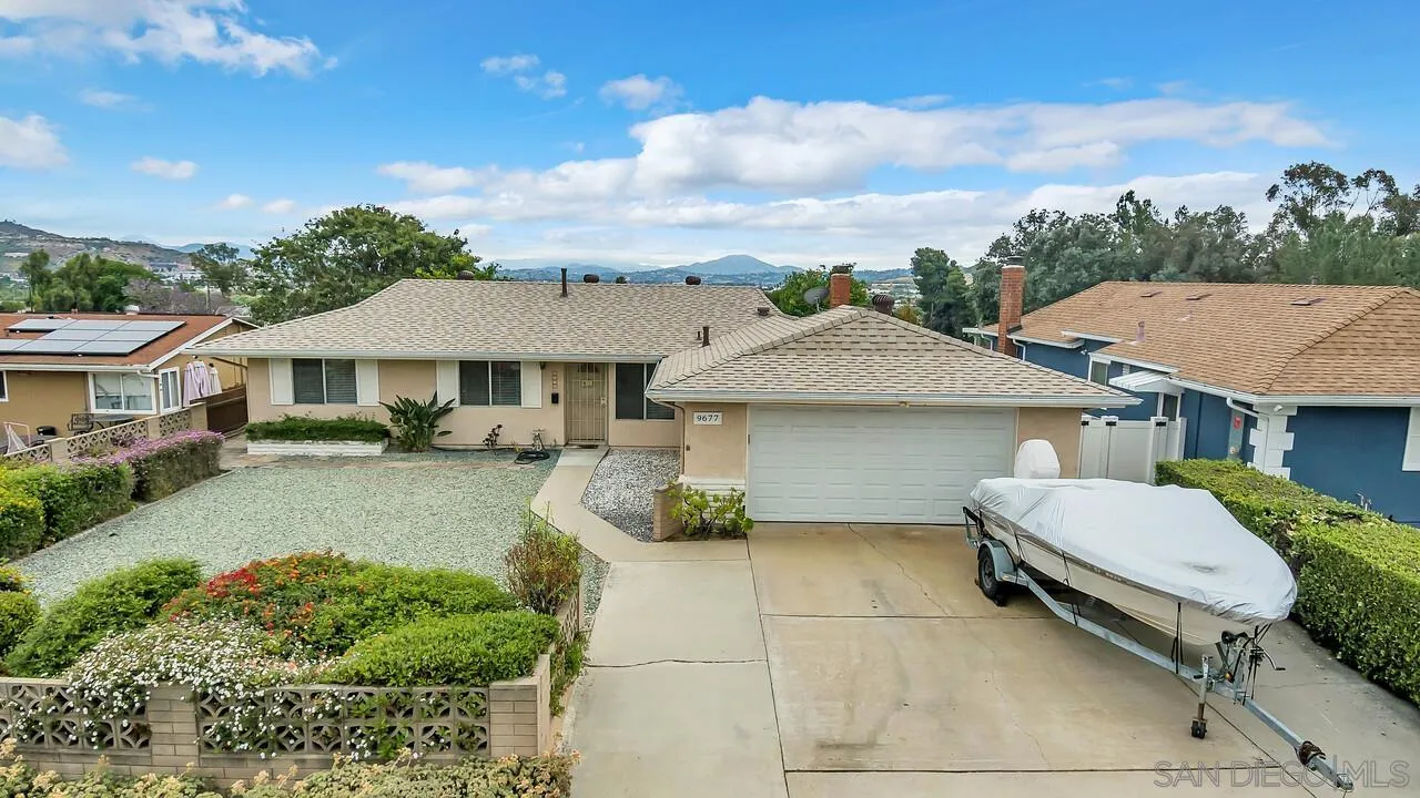 9677 Lutheran Way Santee, CA 92071 - Photo 30 of 33 a front view of a house with garden