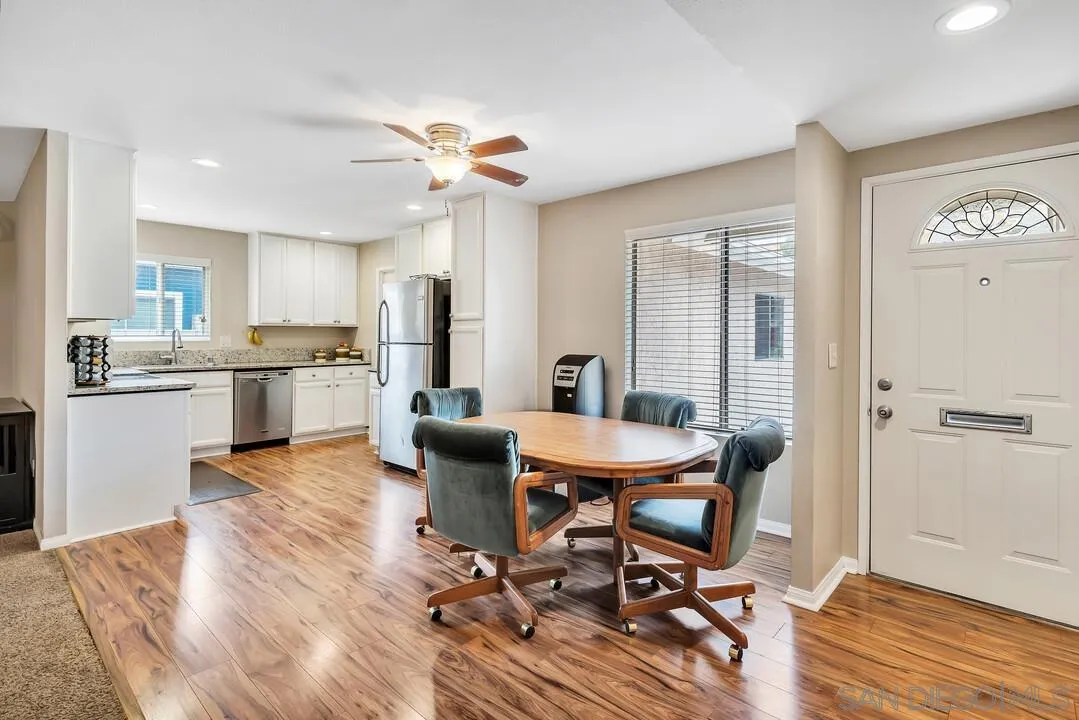 9677 Lutheran Way Santee, CA 92071 - Photo 4 of 33 a view of a dining room with furniture a rug and wooden floor