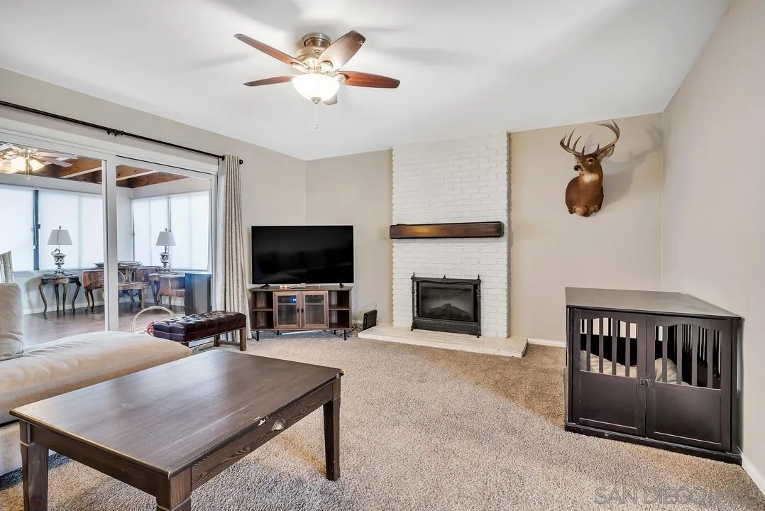 9677 Lutheran Way Santee, CA 92071 - Photo 10 of 33 a living room with furniture and a flat screen tv