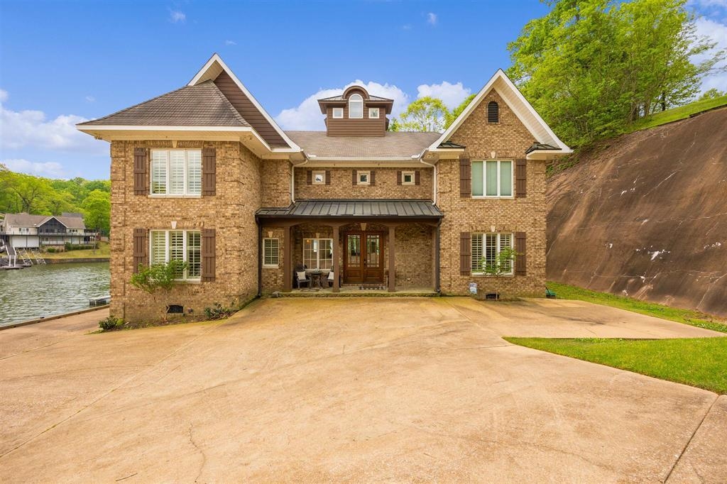 45 Mariner Point Savannah, TN 38372 - Photo 2 of 37 Brick exterior residence featuring multiple gables and a waterside location