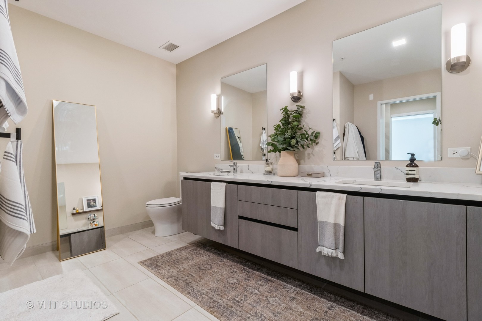 1000 West Monroe Street, Unit 201 Chicago, IL 60607 - Photo 11 of 20 a bathroom with a sink and a mirror