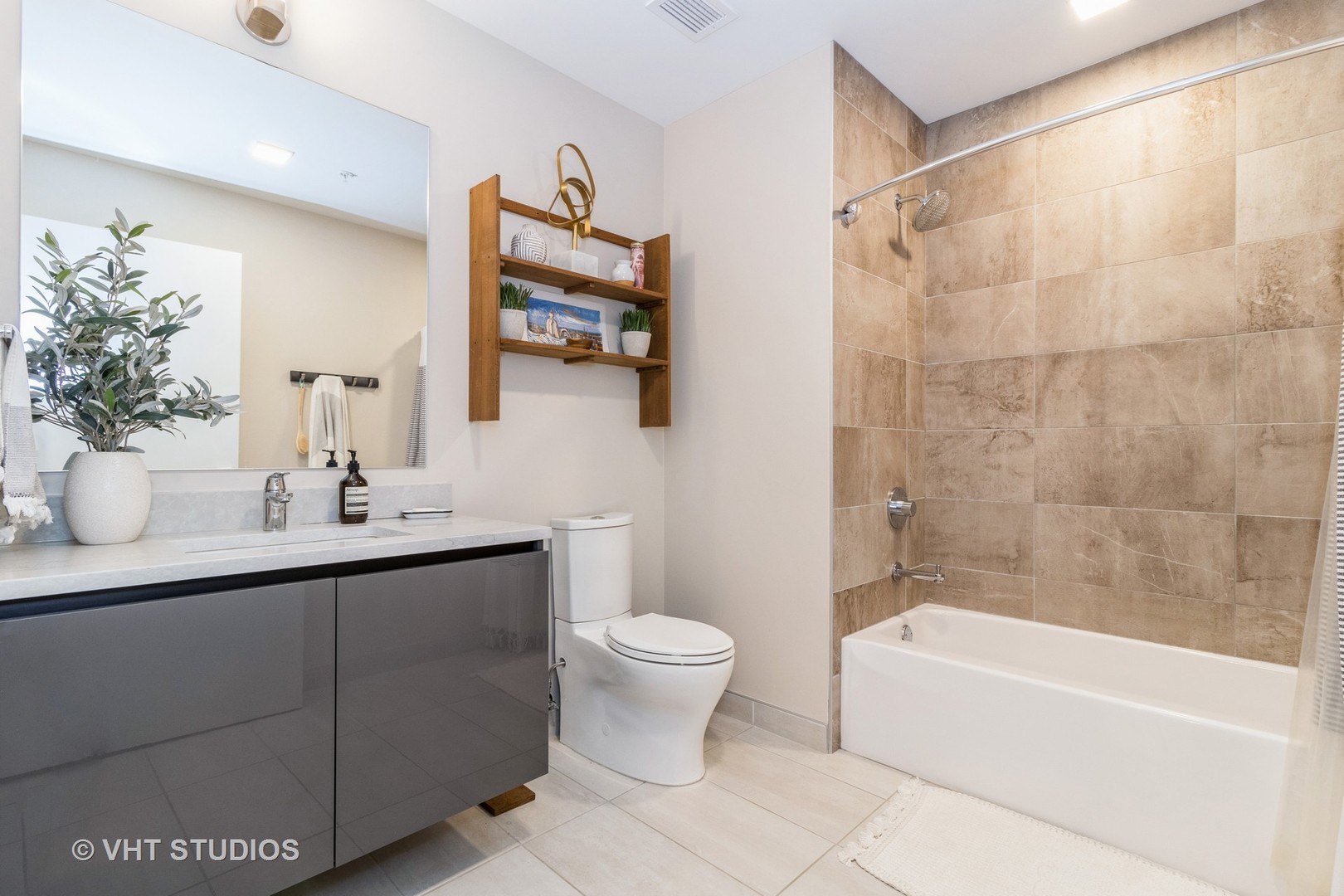 1000 West Monroe Street, Unit 201 Chicago, IL 60607 - Photo 14 of 20 a bathroom with a sink a toilet and shower