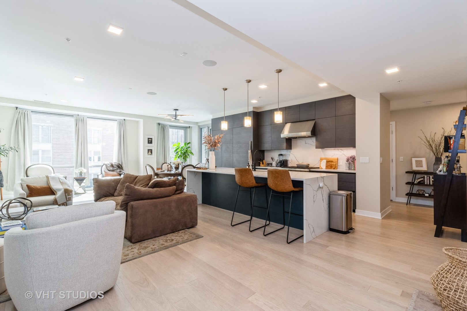 1000 West Monroe Street, Unit 201 Chicago, IL 60607 - Photo 2 of 20 a living room with furniture and a large window