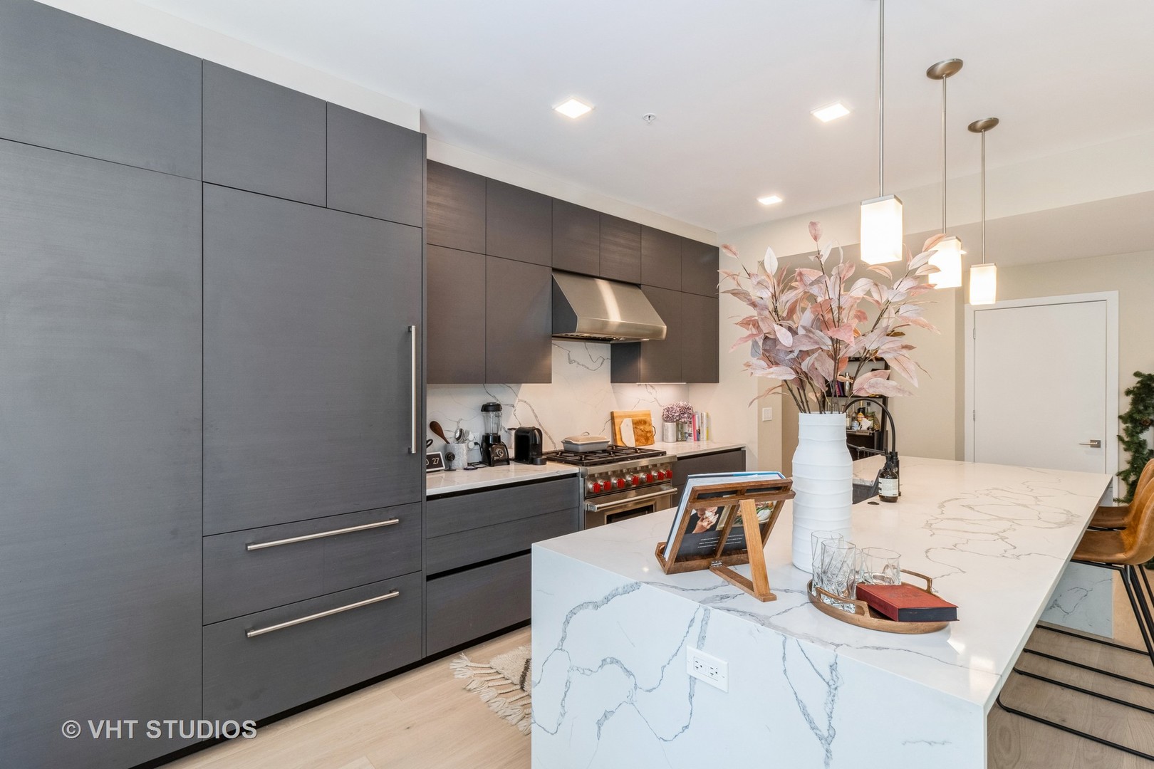 1000 West Monroe Street, Unit 201 Chicago, IL 60607 - Photo 6 of 20 a kitchen with granite countertop a sink cabinets and appliances