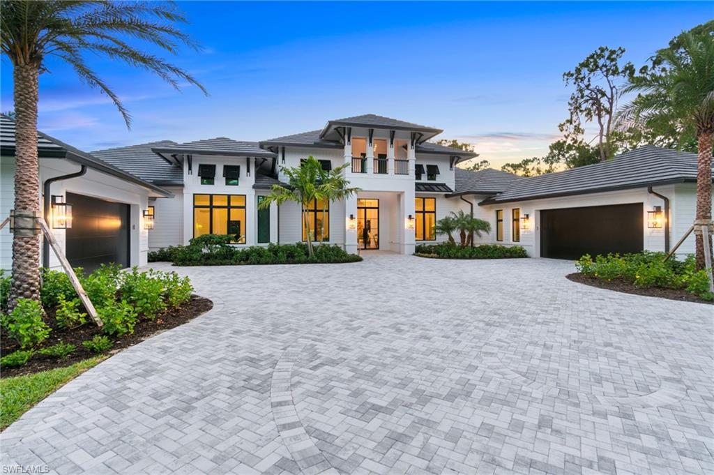 337 West Street Naples, FL 34108 - Photo 1 of 50 View of front of home with a garage