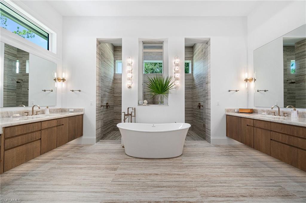 337 West Street Naples, FL 34108 - Photo 26 of 50 Bathroom featuring vanity, shower with separate bathtub, and tile patterned floors