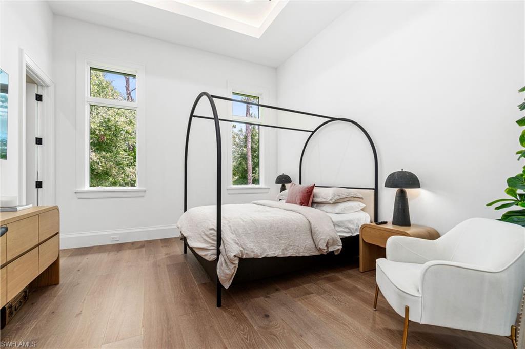 337 West Street Naples, FL 34108 - Photo 37 of 50 Bedroom featuring multiple windows and hardwood / wood-style flooring