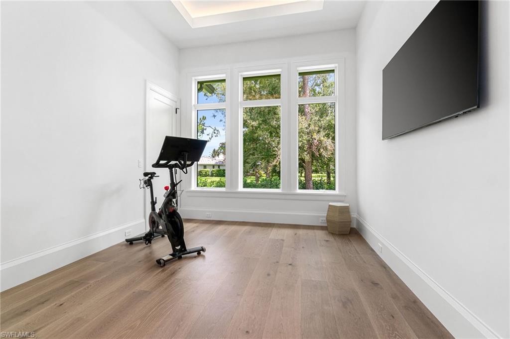 337 West Street Naples, FL 34108 - Photo 40 of 50 Workout area featuring hardwood / wood-style flooring
