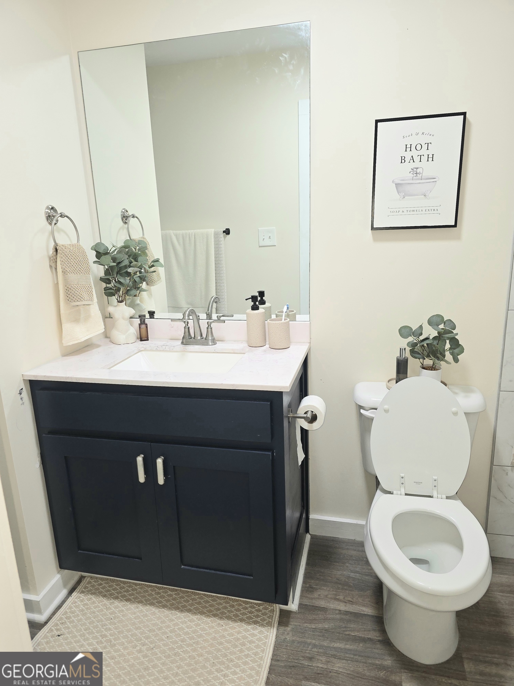 3060 Eatonton Road Madison, GA 30650 - Photo 51 of 65 a bathroom with a sink and a toilet