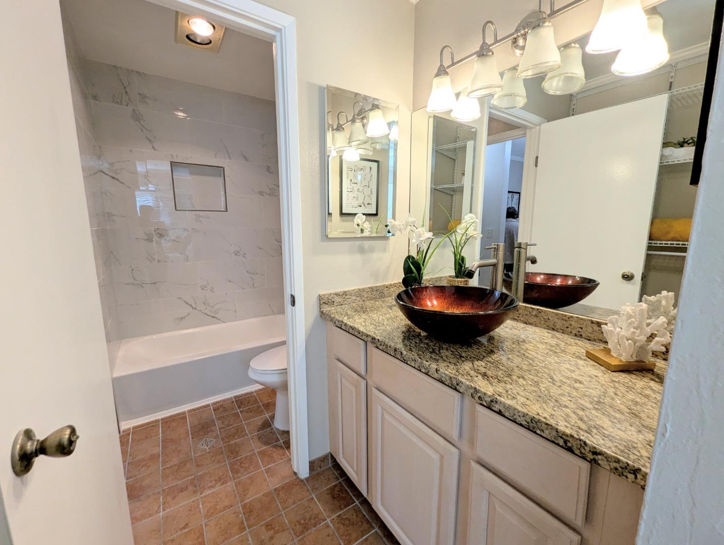 960 Kiely Boulevard, Unit F Santa Clara, CA 95051 - Photo 11 of 23 a bathroom with a granite countertop sink a toilet and bathtub