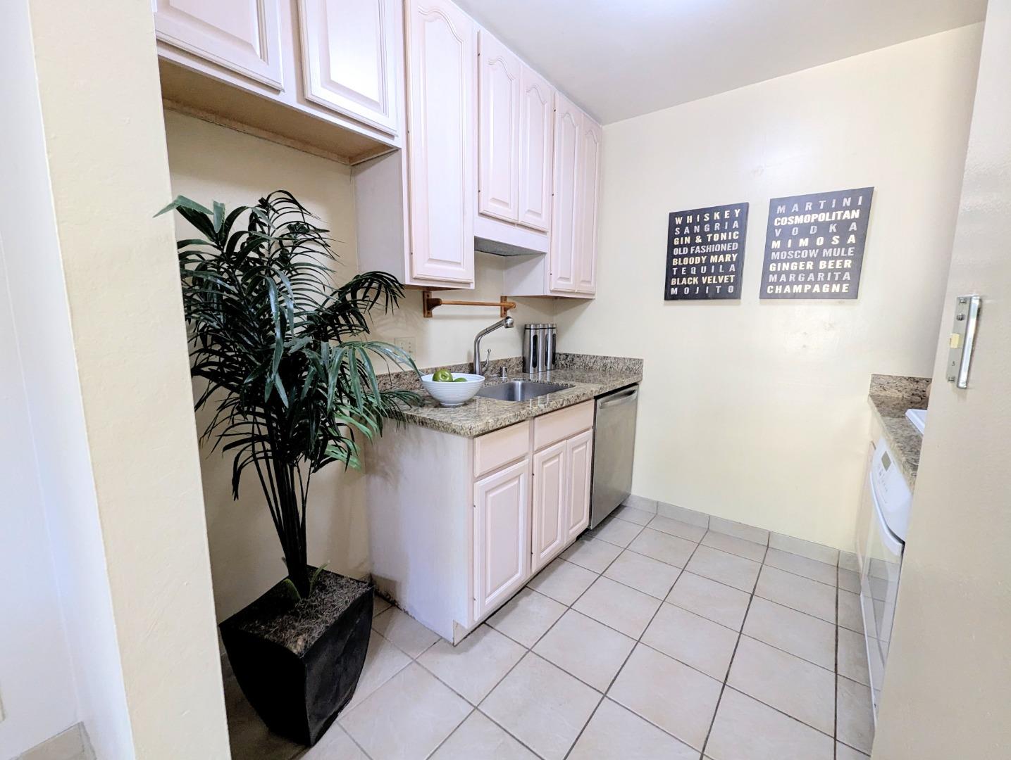 960 Kiely Boulevard, Unit F Santa Clara, CA 95051 - Photo 6 of 23 a kitchen with a sink and cabinets