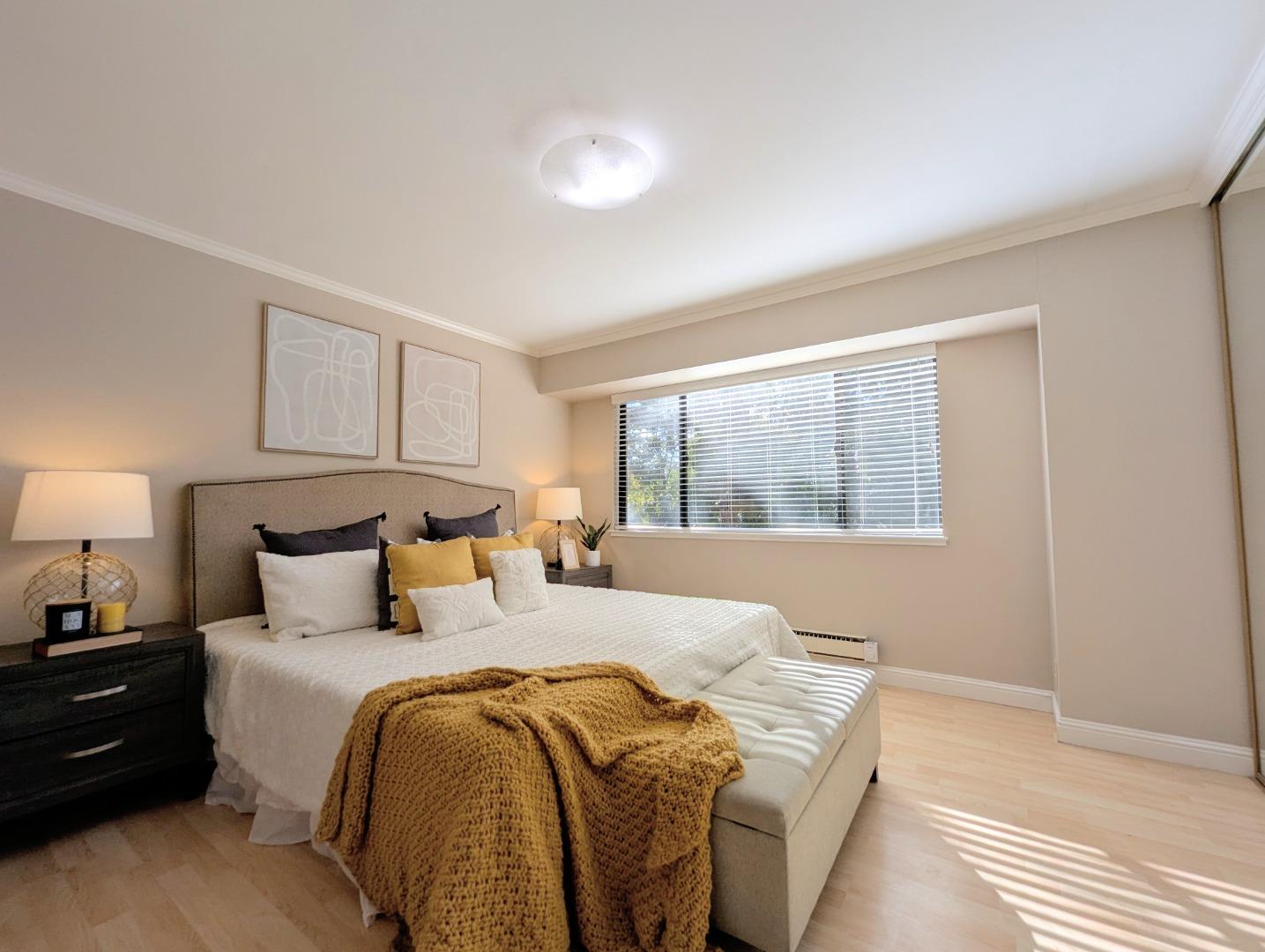 960 Kiely Boulevard, Unit F Santa Clara, CA 95051 - Photo 8 of 23 a bedroom with a bed and a large window