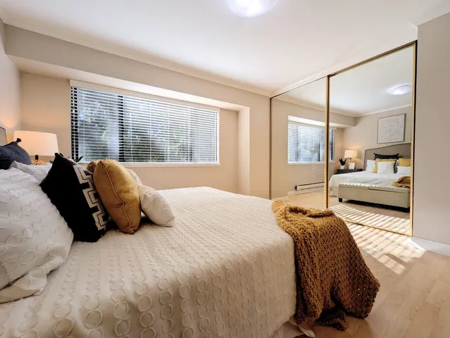 a bedroom with a bed and window