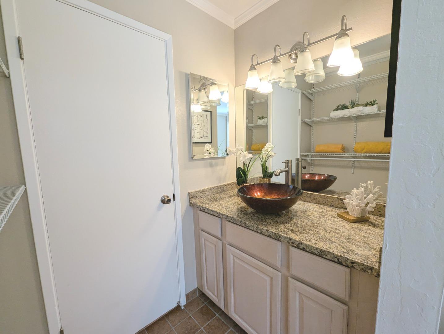 960 Kiely Boulevard, Unit F Santa Clara, CA 95051 - Photo 10 of 23 a bathroom with a granite countertop sink and a mirror
