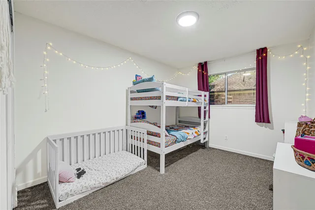 a room with furniture and white walls