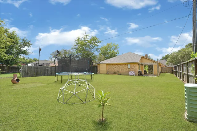 a view of a playground with basketball court