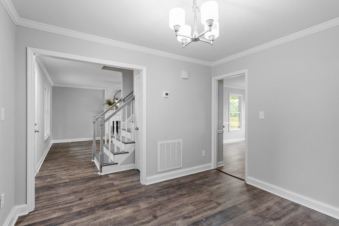 Undisclosed Address Wake Forest, NC 27587 - Photo 11 of 26 wooden floor in an empty room with a window