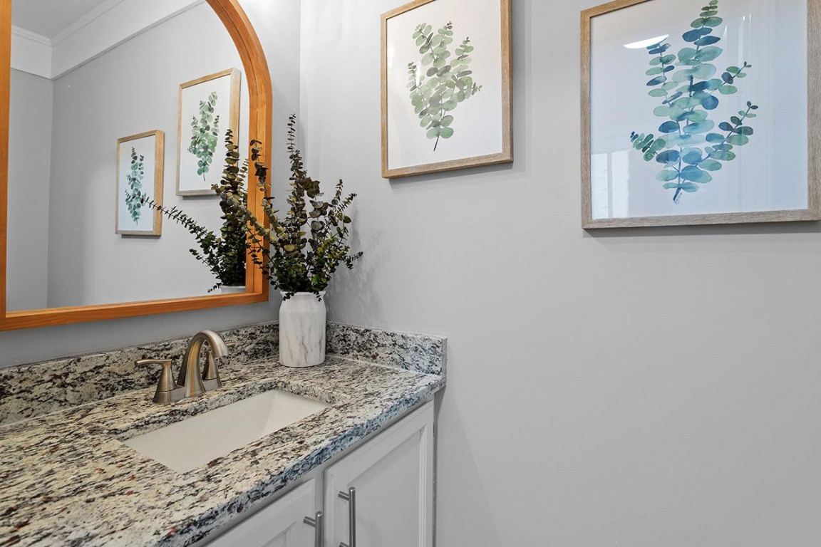 Undisclosed Address Wake Forest, NC 27587 - Photo 12 of 26 a bathroom with a granite countertop sink and a mirror