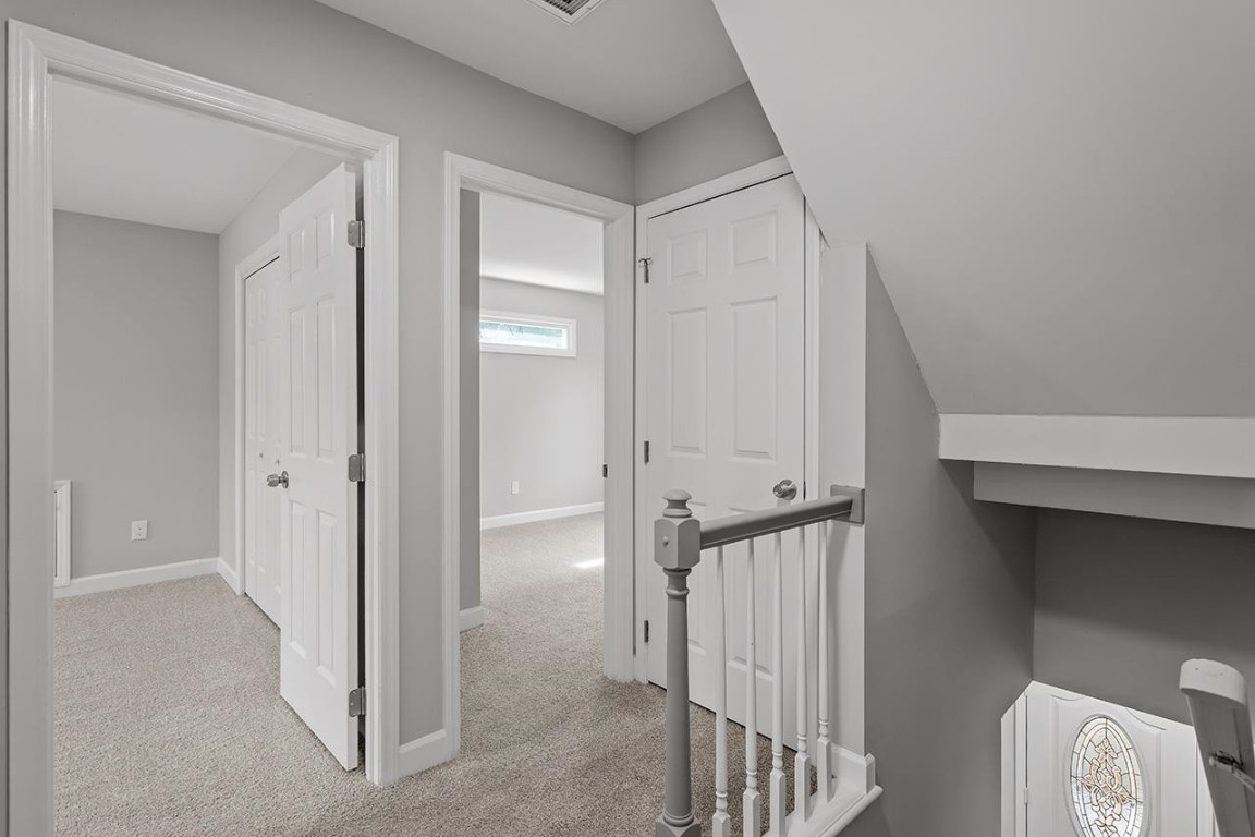 Undisclosed Address Wake Forest, NC 27587 - Photo 20 of 26 a view of a hallway with wooden floor and entryway
