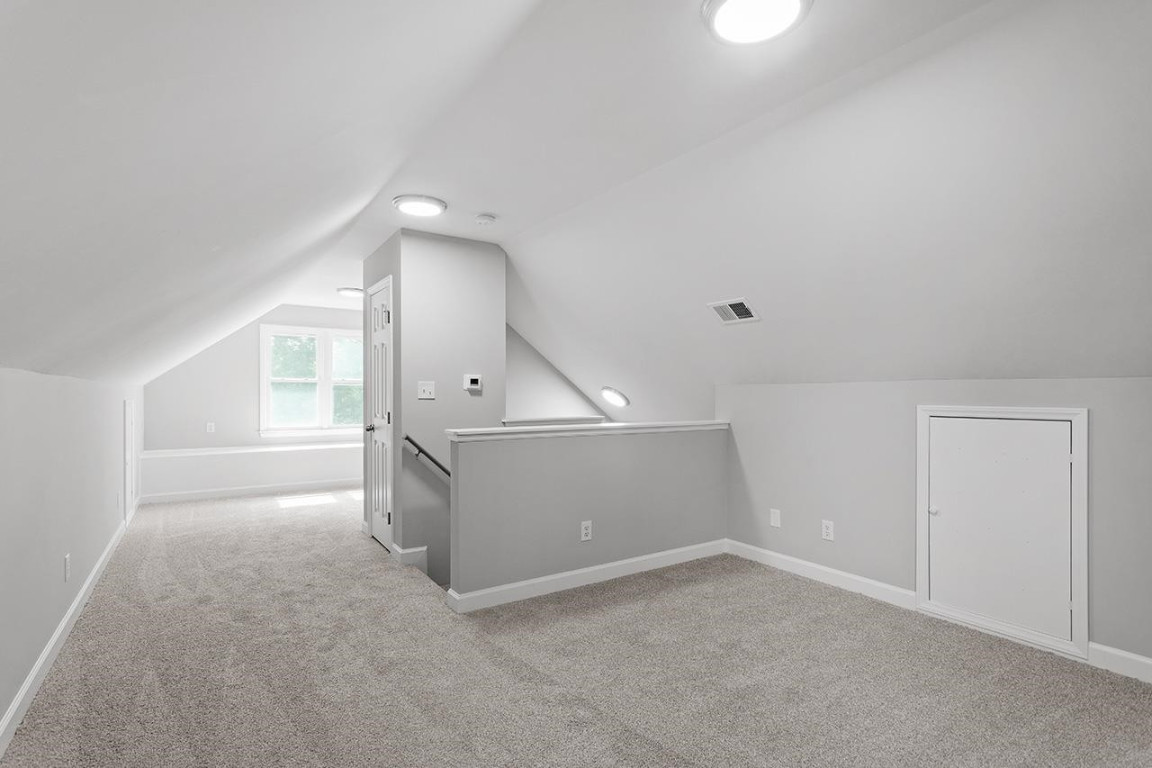 Undisclosed Address Wake Forest, NC 27587 - Photo 21 of 26 a view of a hallway with an empty room