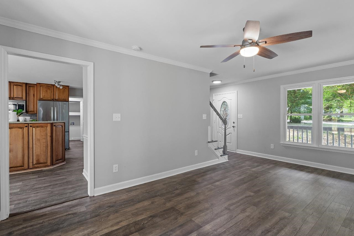 Undisclosed Address Wake Forest, NC 27587 - Photo 4 of 26 a view of empty room with wooden floor and fan