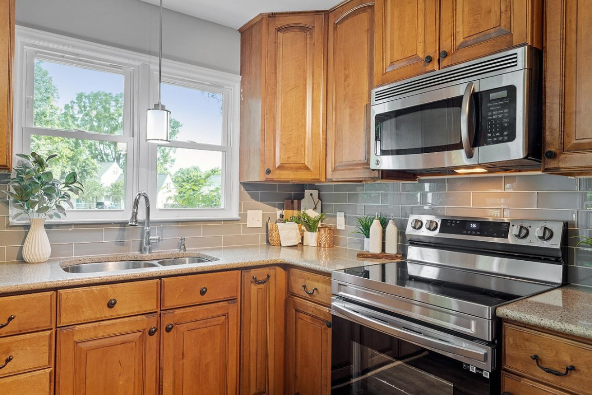 Undisclosed Address Wake Forest, NC 27587 - Photo 7 of 26 a kitchen with stainless steel appliances a stove a sink and a microwave