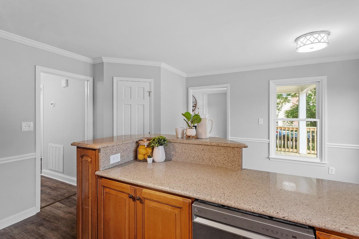 Undisclosed Address Wake Forest, NC 27587 - Photo 8 of 26 a living room with a sink and a window