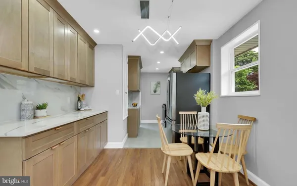 a view of a kitchen and dining room