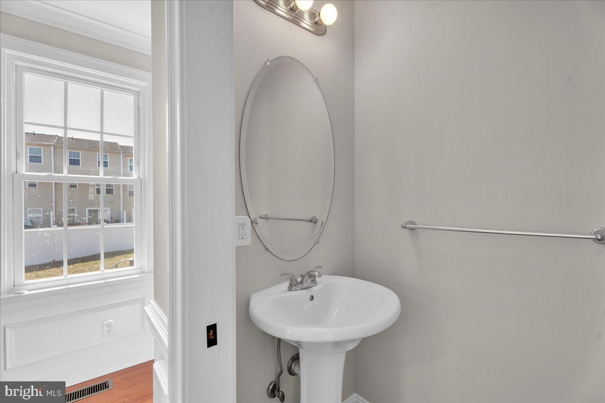 101 Center Avenue Mount Ephraim, NJ 08059 - Photo 12 of 42 a bathroom with a sink and a mirror