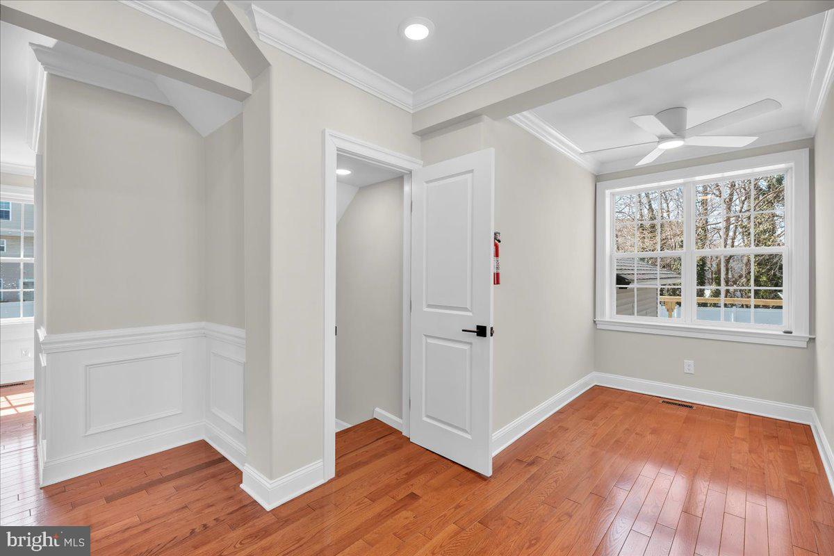 101 Center Avenue Mount Ephraim, NJ 08059 - Photo 13 of 42 an empty room with wooden floor and windows