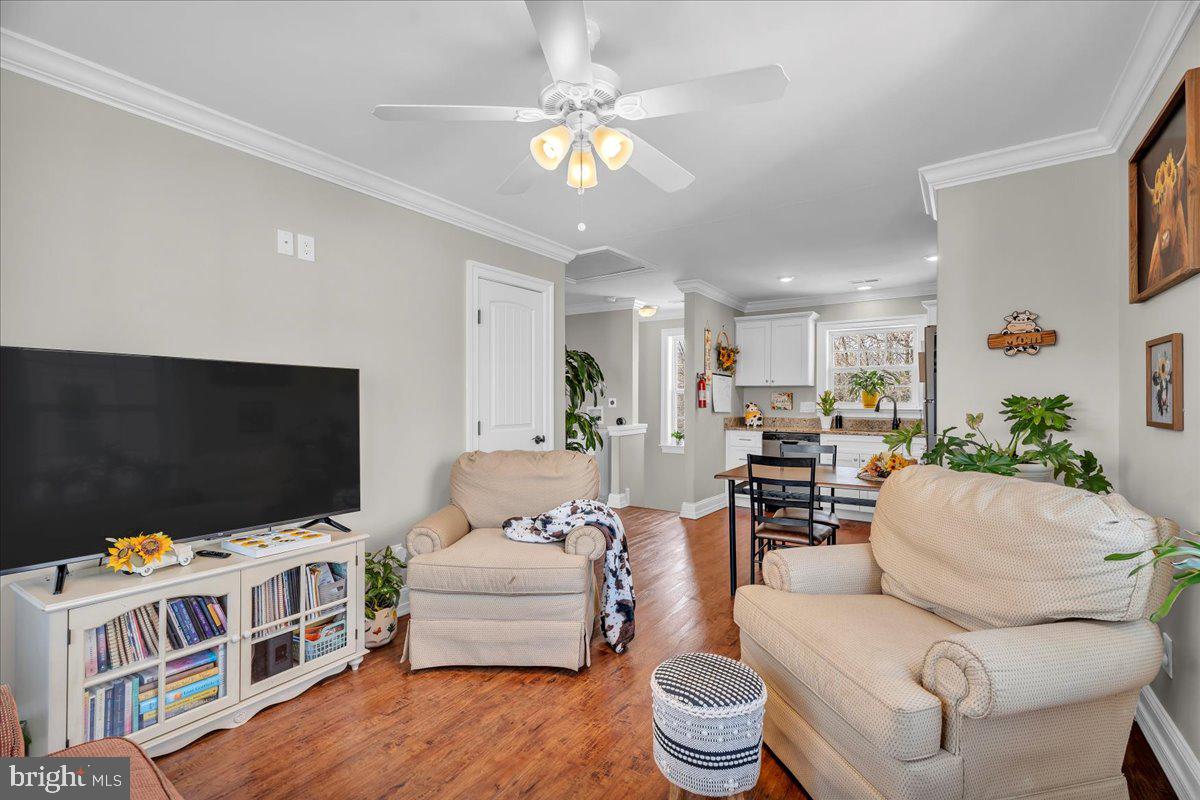 101 Center Avenue Mount Ephraim, NJ 08059 - Photo 24 of 42 a living room with furniture and a flat screen tv