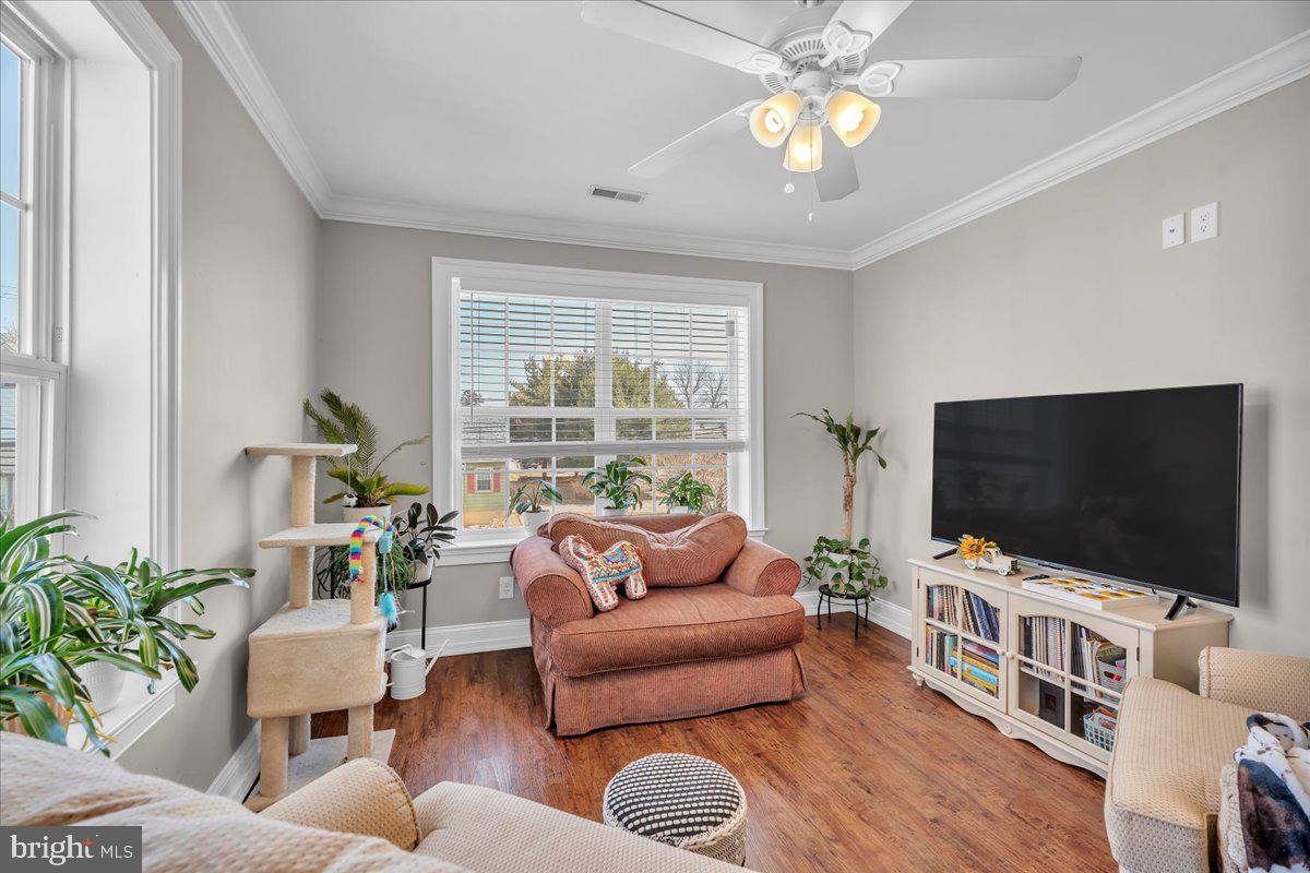 101 Center Avenue Mount Ephraim, NJ 08059 - Photo 25 of 42 a living room with furniture and a flat screen tv