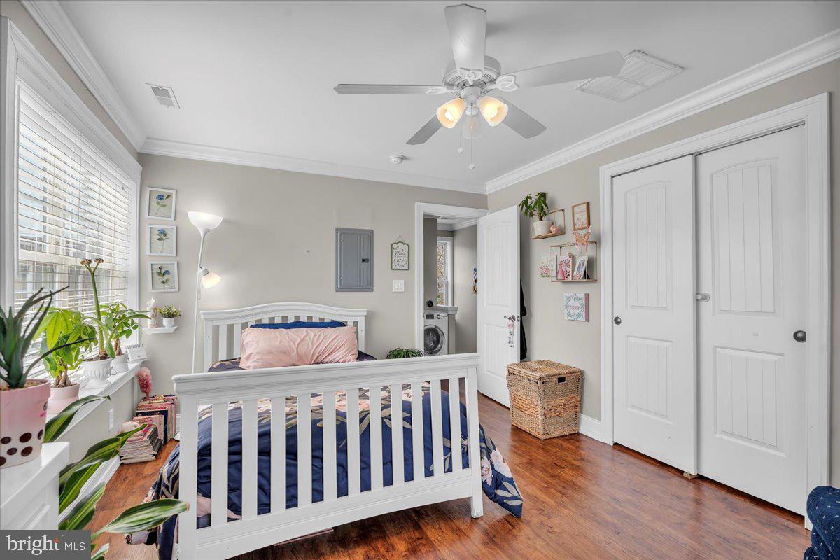 101 Center Avenue Mount Ephraim, NJ 08059 - Photo 30 of 42 a bedroom with a bed and wooden floor