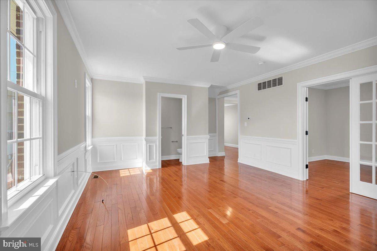 101 Center Avenue Mount Ephraim, NJ 08059 - Photo 6 of 42 a view of an empty room with wooden floor and a window