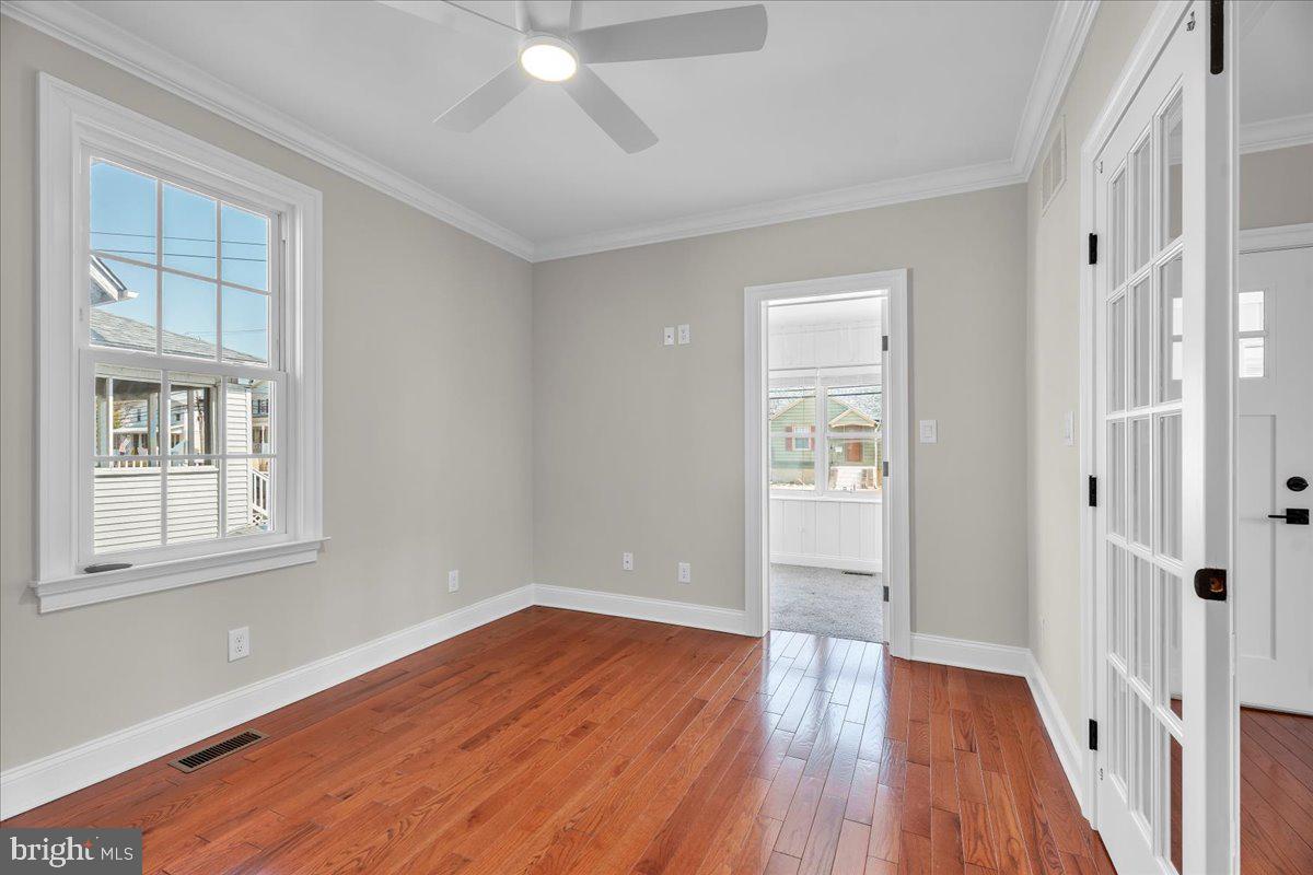 101 Center Avenue Mount Ephraim, NJ 08059 - Photo 8 of 42 wooden floor in an empty room with a window