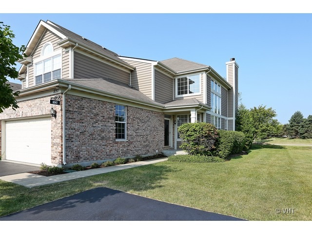 897 Havenshire Road, Unit 897 Naperville, IL 60565 - Photo 1 of 14 a front view of a house with a garden