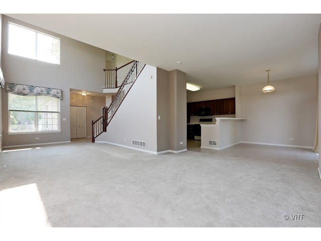 897 Havenshire Road, Unit 897 Naperville, IL 60565 - Photo 3 of 14 a view of empty room with a kitchen and window
