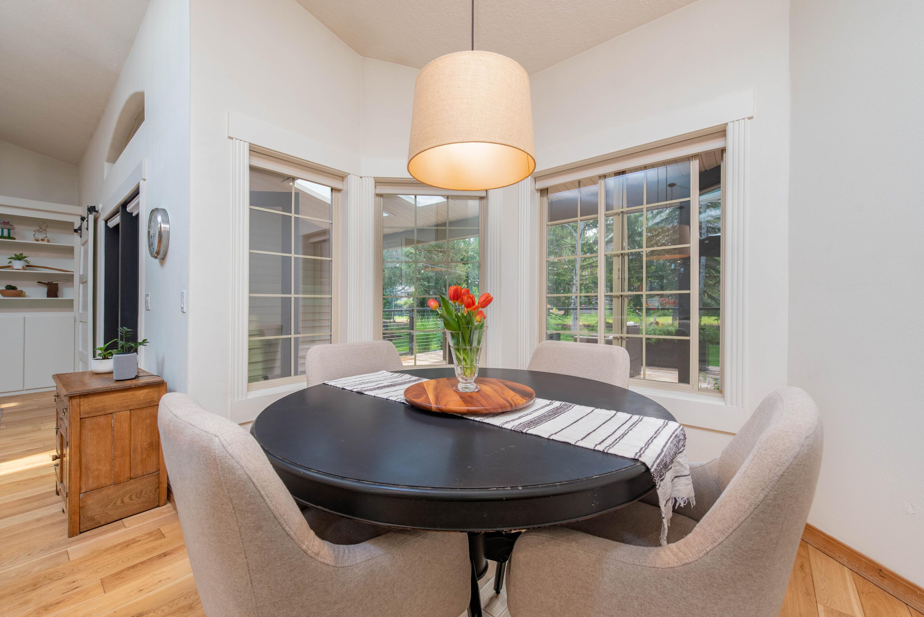 2701 Northwest Strath Way Bend, OR 97703 - Photo 16 of 41 Eating nook surrounded with windows to the backyard and deck.