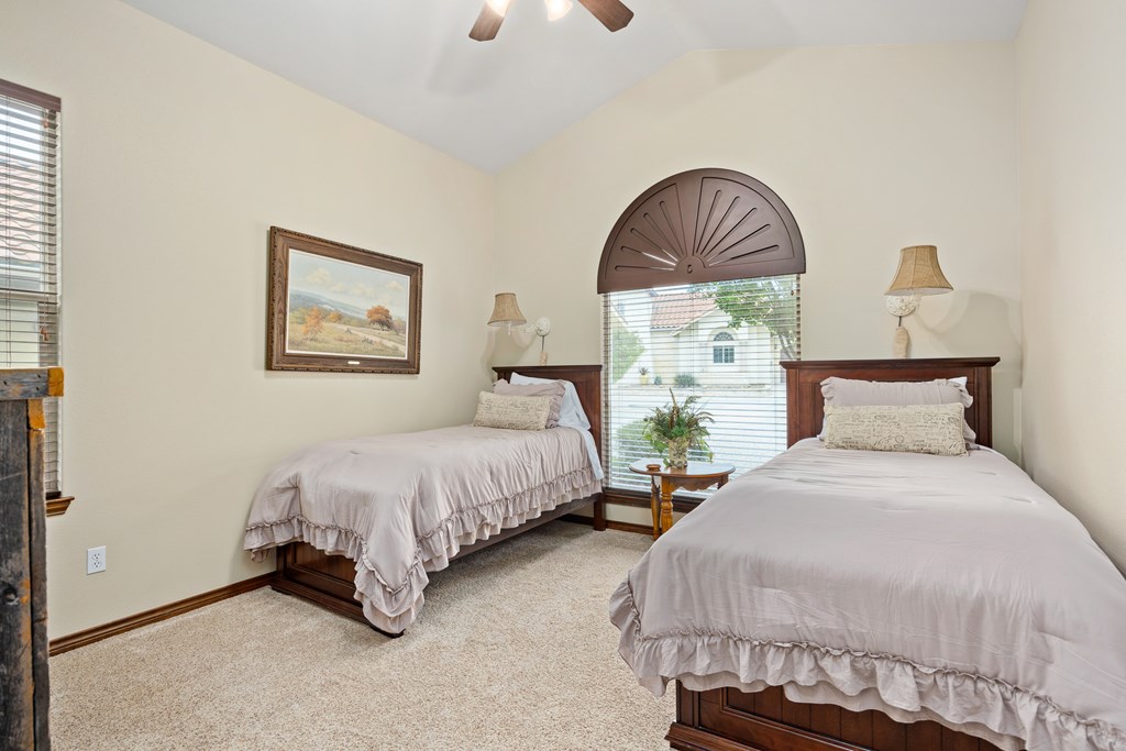 3801-16 Club House Road Kerrville, TX 78028 - Photo 15 of 22 a bedroom with bed and a window