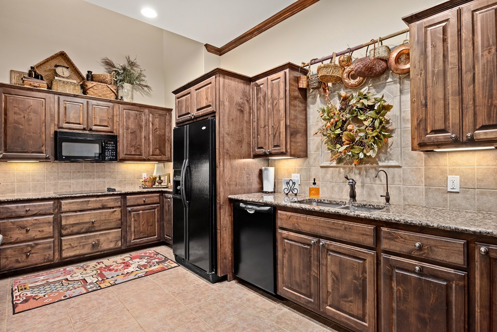 3801-16 Club House Road Kerrville, TX 78028 - Photo 4 of 22 a kitchen with stainless steel appliances granite countertop a sink stove and refrigerator