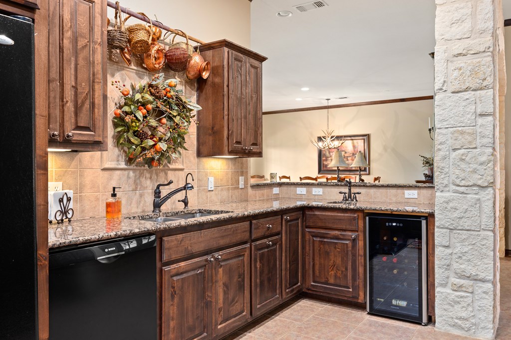 3801-16 Club House Road Kerrville, TX 78028 - Photo 6 of 22 a kitchen with a sink and cabinets