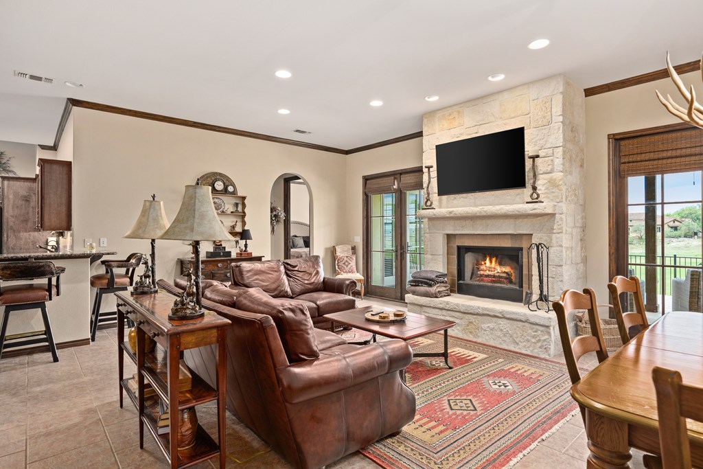 3801-16 Club House Road Kerrville, TX 78028 - Photo 8 of 22 a living room with furniture fireplace and flat screen tv