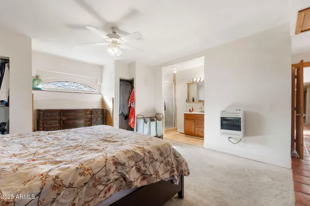 a bathroom with a sink a mirror and a shower