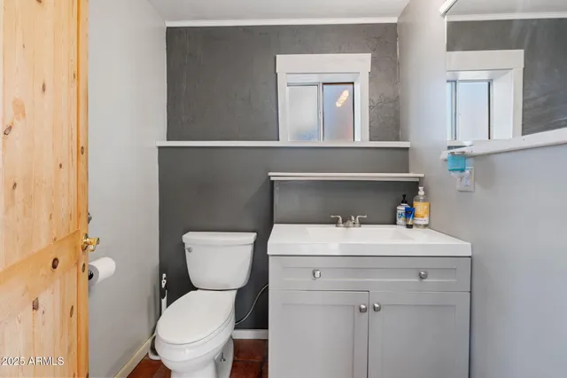 a room with a bed and a large window