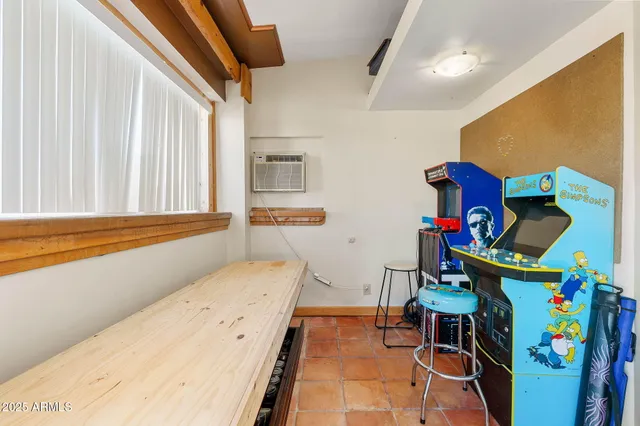 a bedroom with furniture and a baby crib