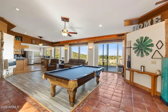 a large kitchen with lots of counter space and windows